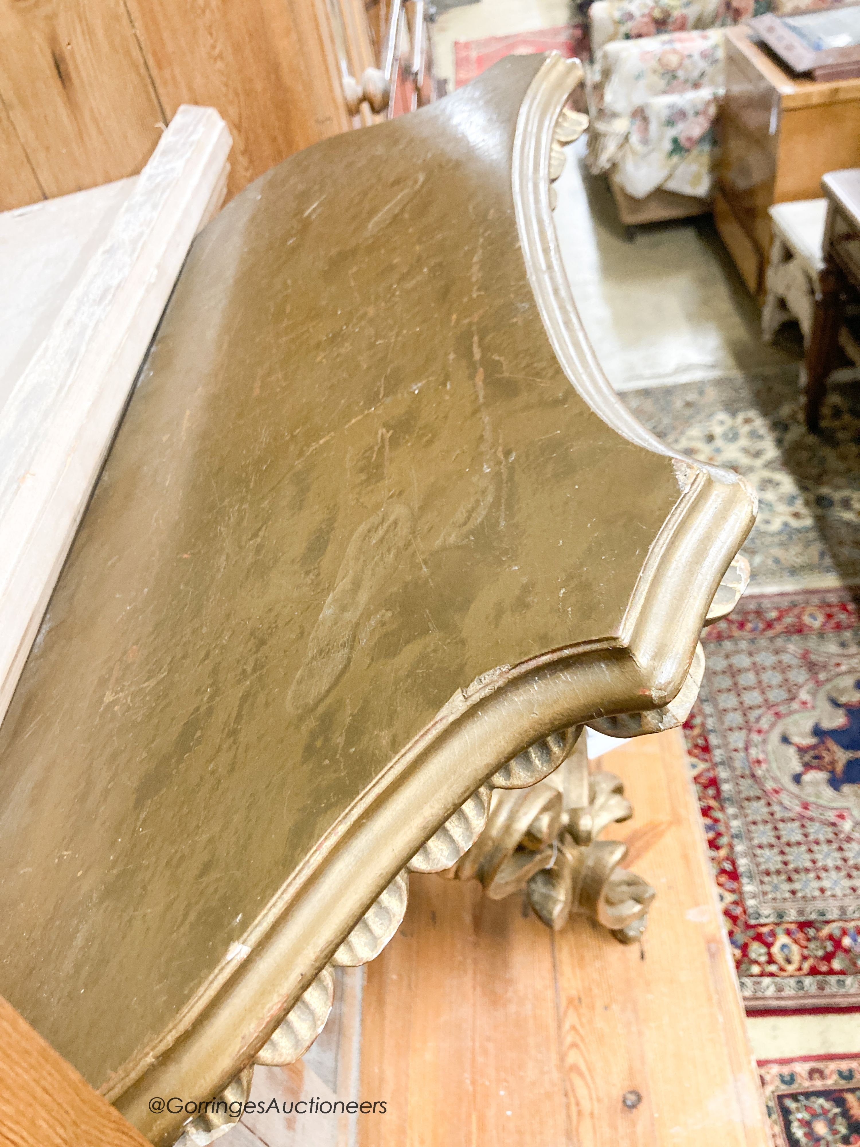 An Italian carved pine gilt console table, width 66cm, depth 38cm, height 67cm